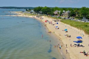 Alt text (for the August events post): Beachgoers enjoying the sandy Cape Charles beach along the Chesapeake Bay in late summer, a highlight of August events in Cape Charles