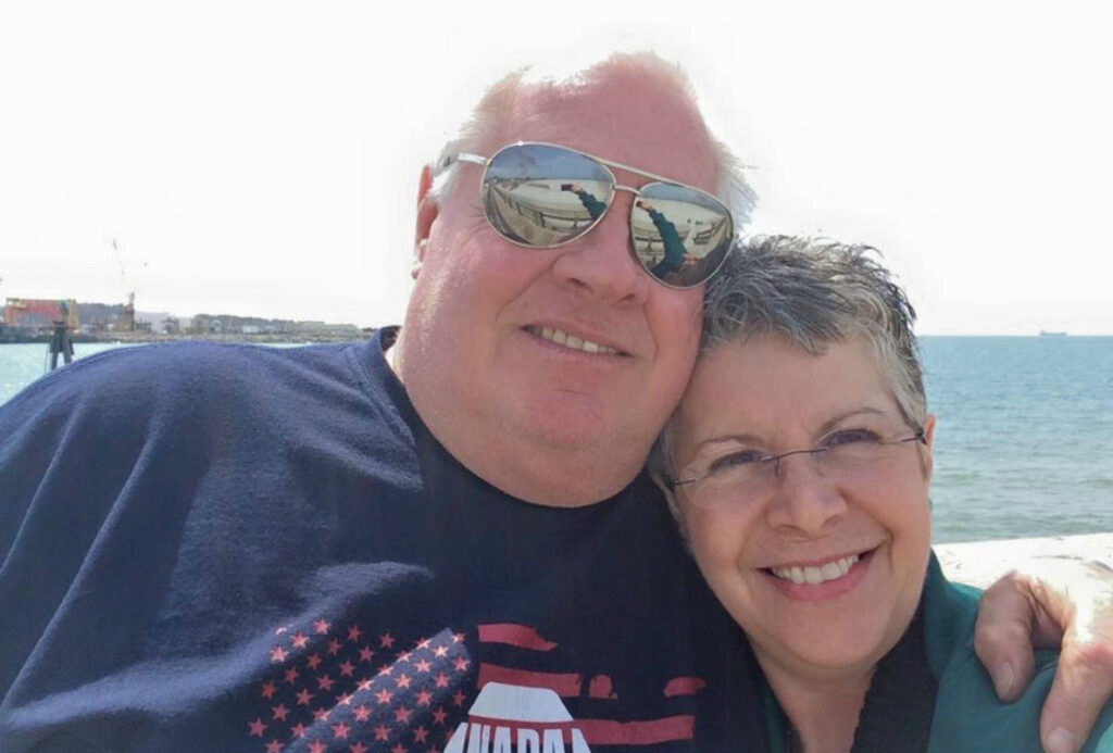 Kathy and her husband, Skip, taking a walk on the Cape Charles beach.