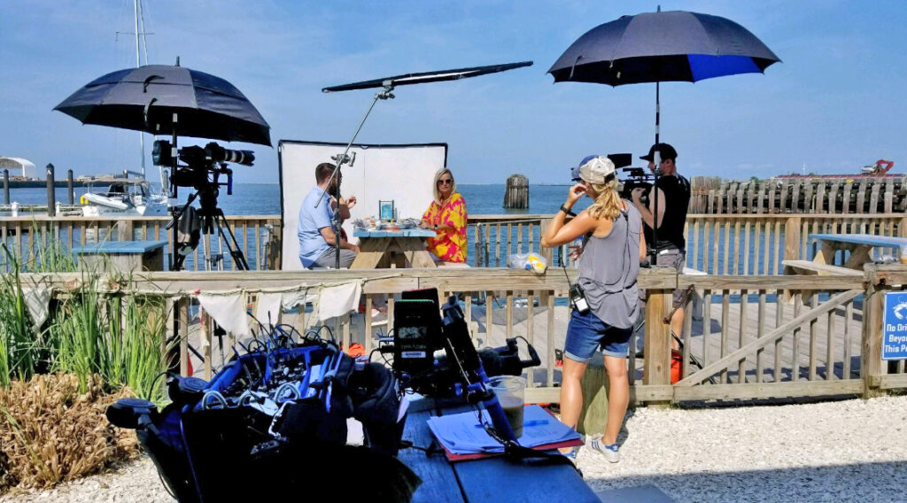 Eva filming an episode of HGTV's Beachfront Bargain Hunt at The Shanty in Cape Charles.