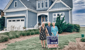 House for sale sign in Cape Charles VA neighborhood