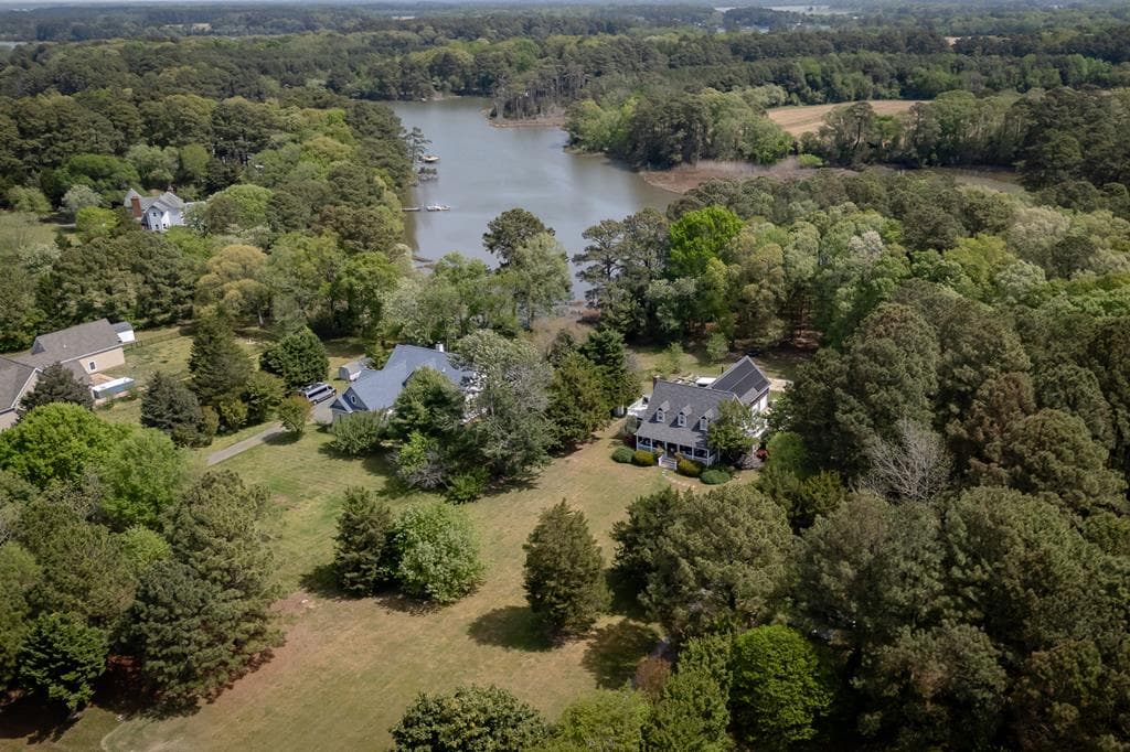 Aerial view of waterfront homes along a tidal creek in Cape Charles Virginia — flood insurance Virginia buyers guide