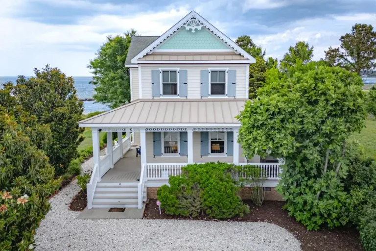 Coastal cottage with wraparound porch and Chesapeake Bay views at 4 Bay Vistas Way Cape Charles Virginia — moving to Cape Charles full-time