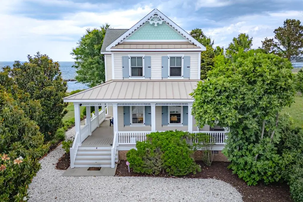 Coastal cottage with wraparound porch and Chesapeake Bay views at 4 Bay Vistas Way Cape Charles Virginia — moving to Cape Charles full-time