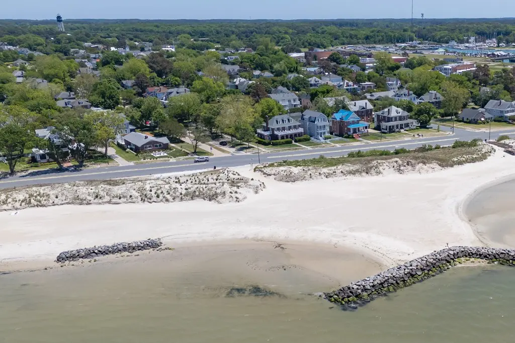Aerial view of Cape Charles Virginia Historic District homes along the Chesapeake Bay beach — Cape Charles real estate market summer 2026